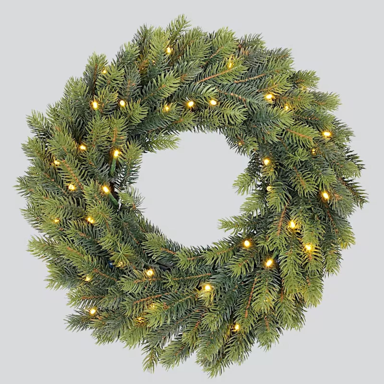 Corona natalizia dietro porta verde con 50 led bianco caldo - Lumin