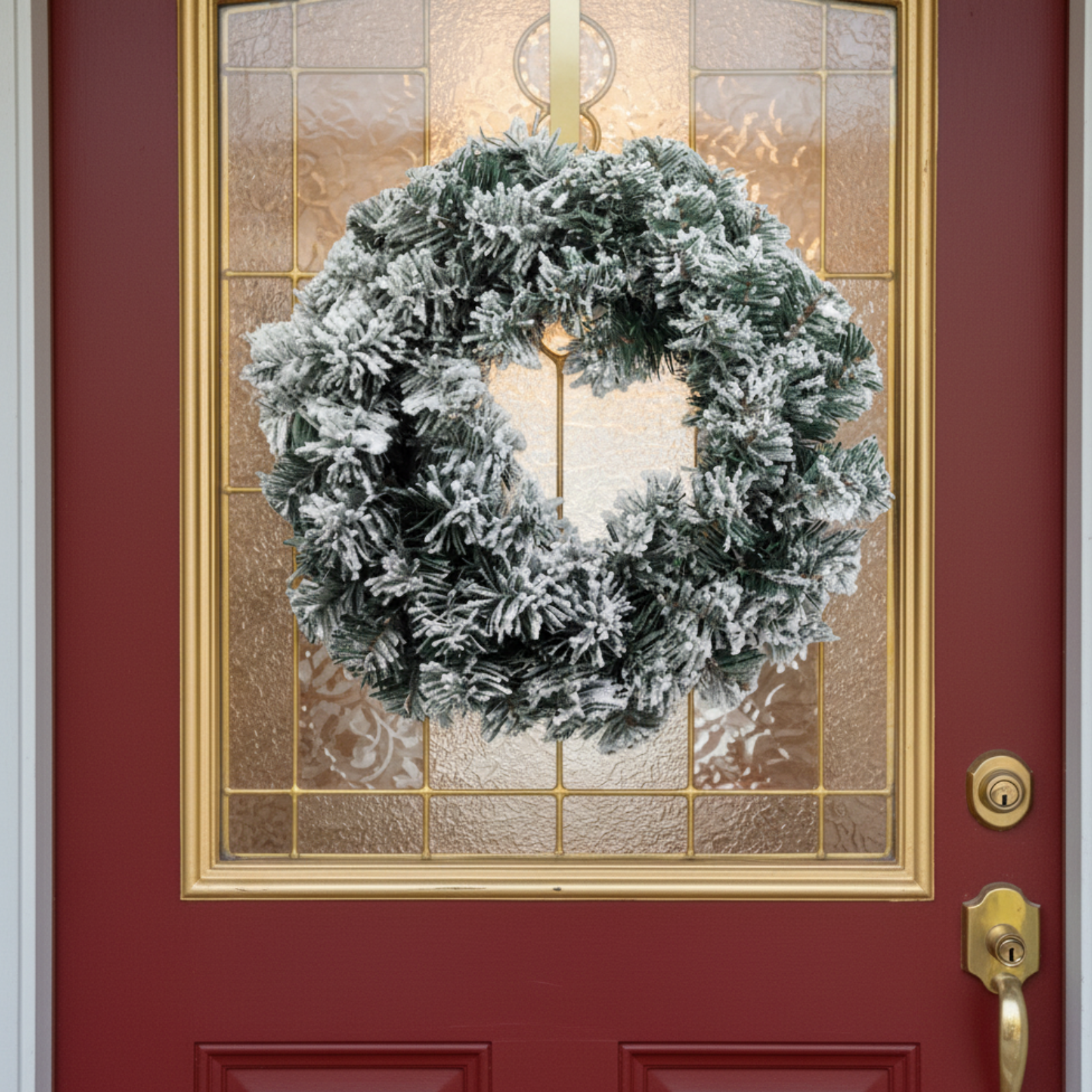 Corona dietro porta innevata decorazione natalizia 35 cm - Portalia